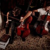 2 Cellos preparing for the rehearsal